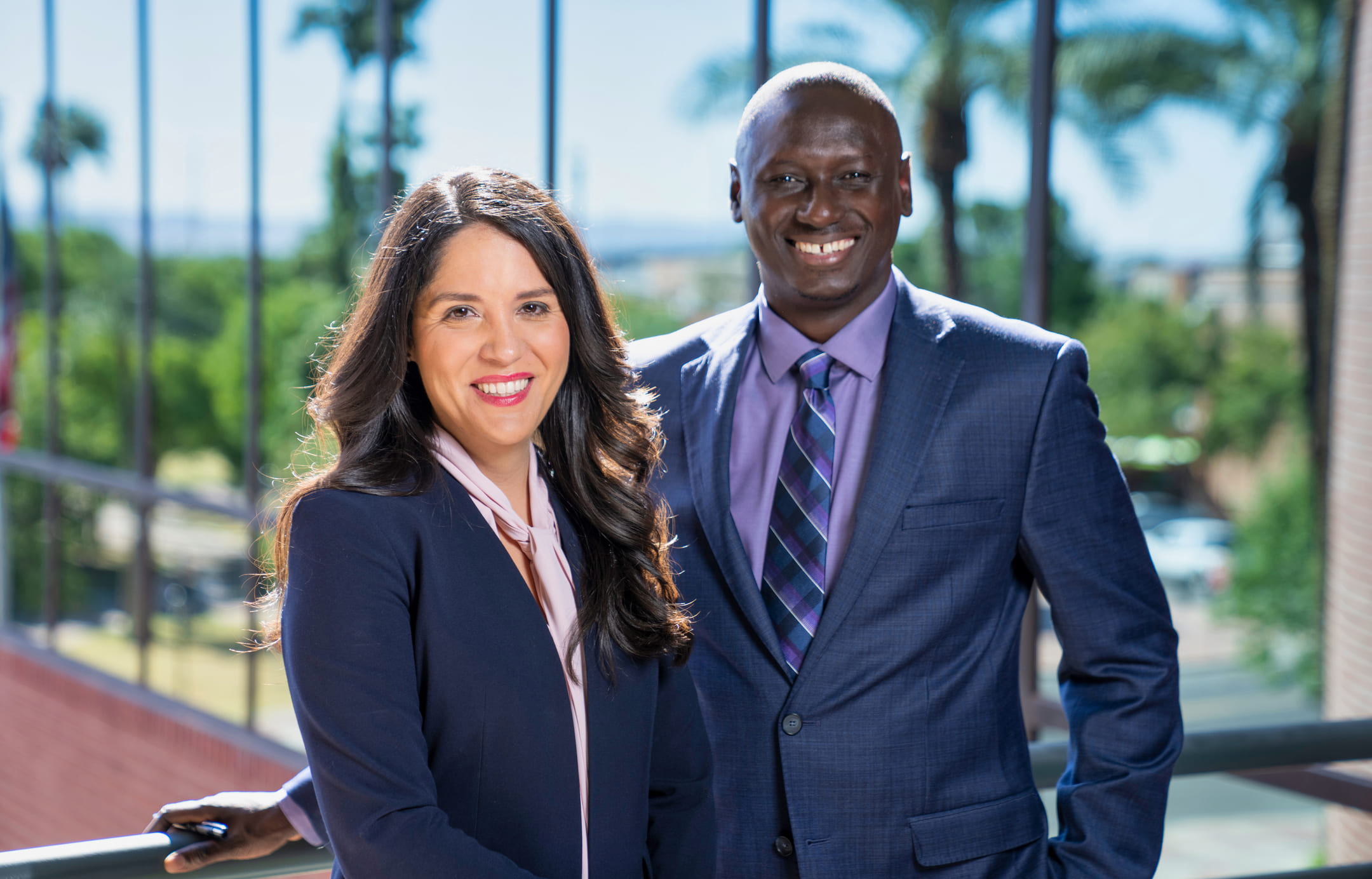 Two professional personal injury lawyers standing outside at Accident Justice Law in Arizona