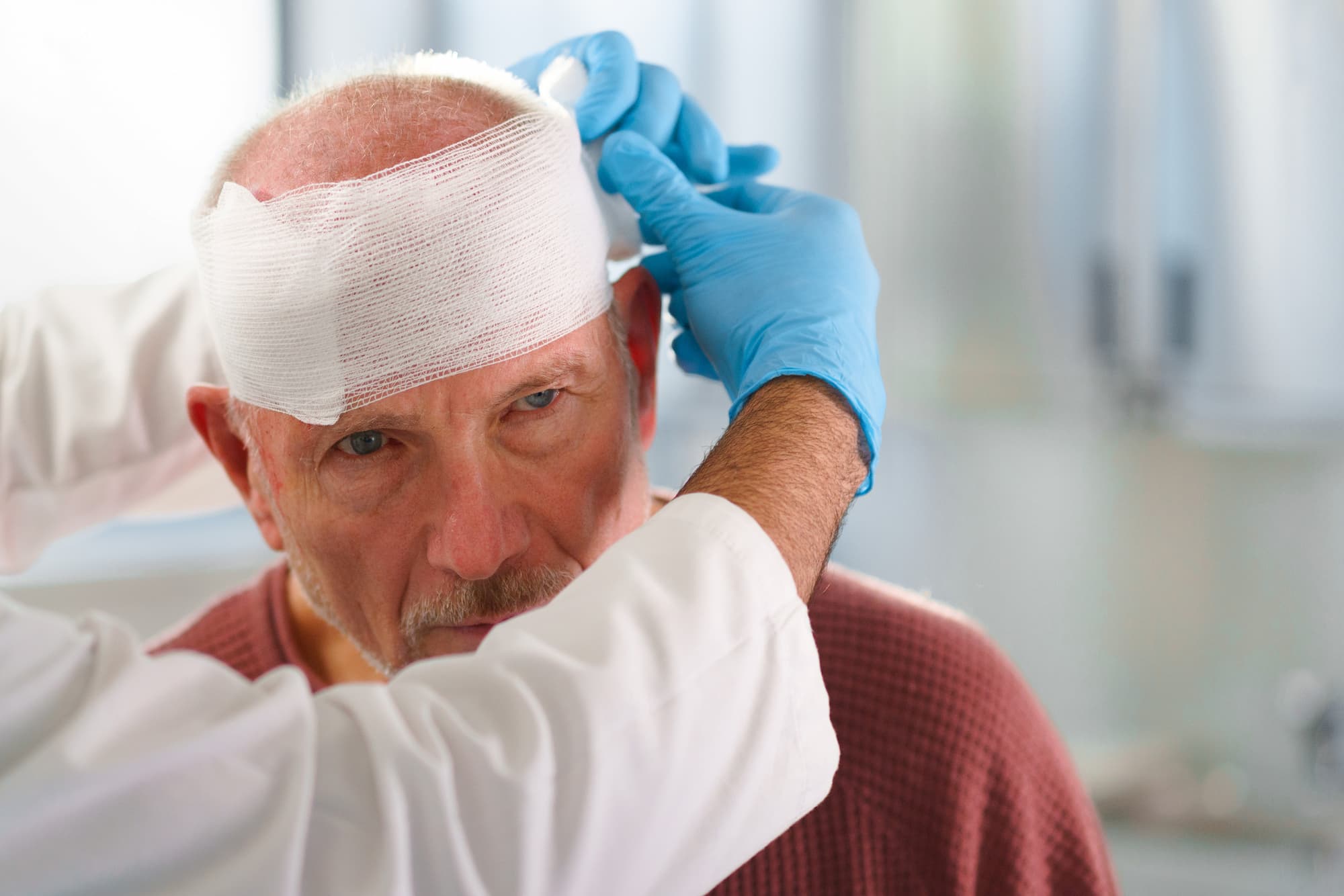 brain injury victim with bandage around head